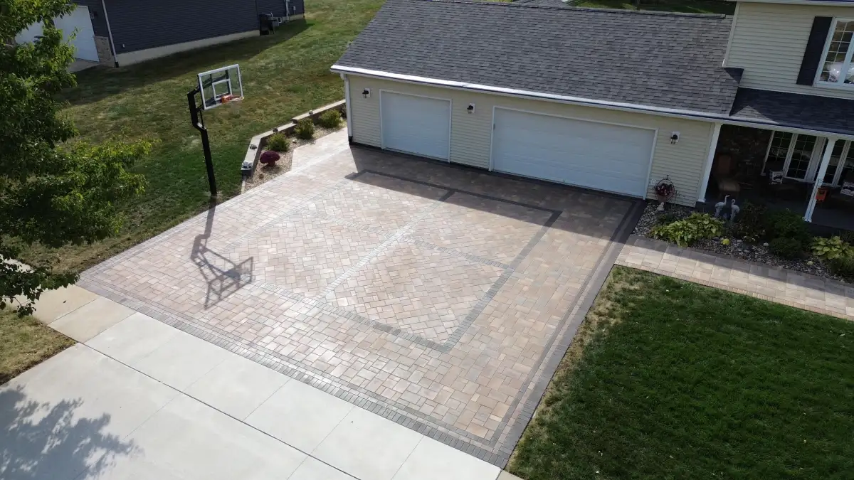 Tan paver driveway with diamond inlay pattern